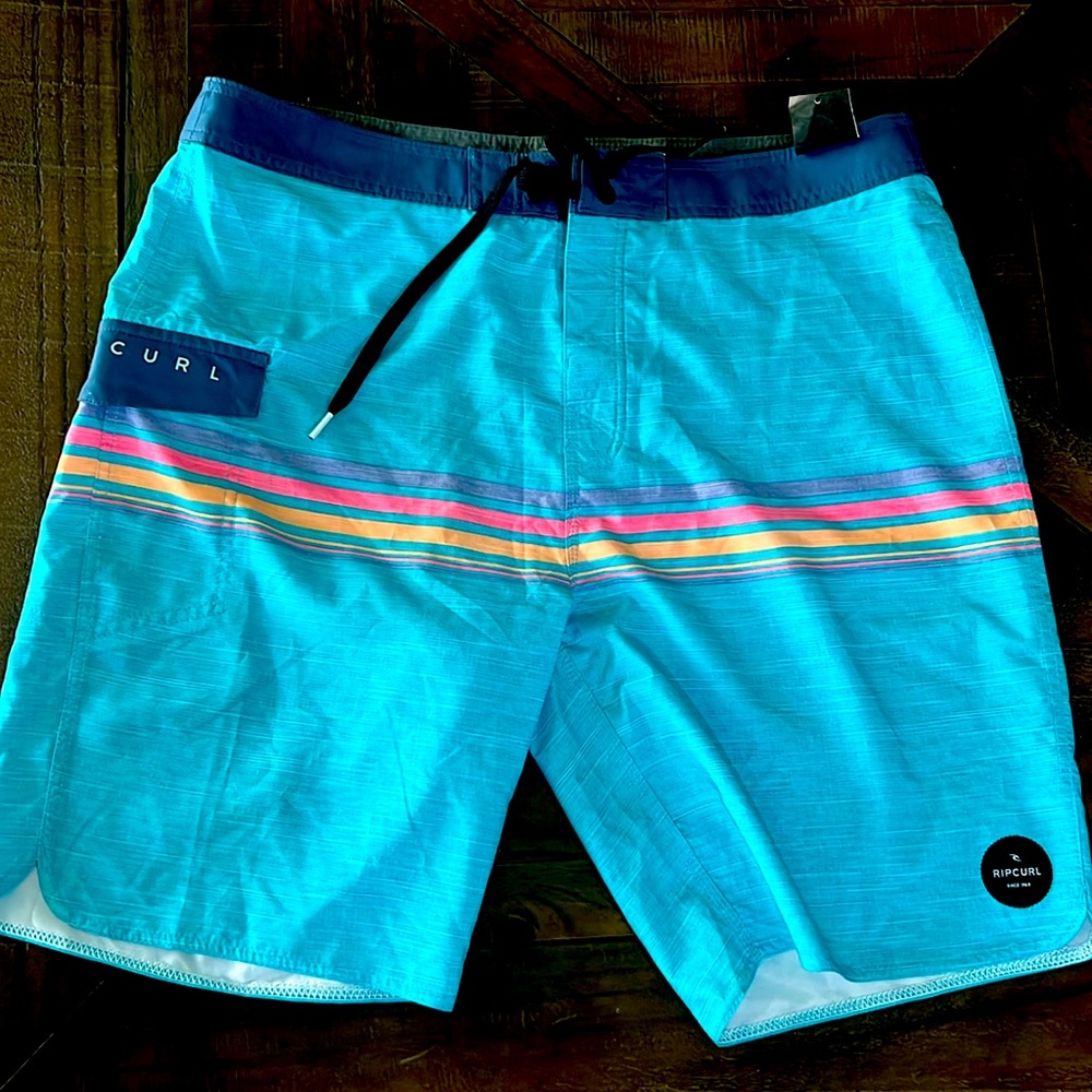 NWT Ripcurl men’s board shorts. Size 36, 20” length. Aqua blue striped.